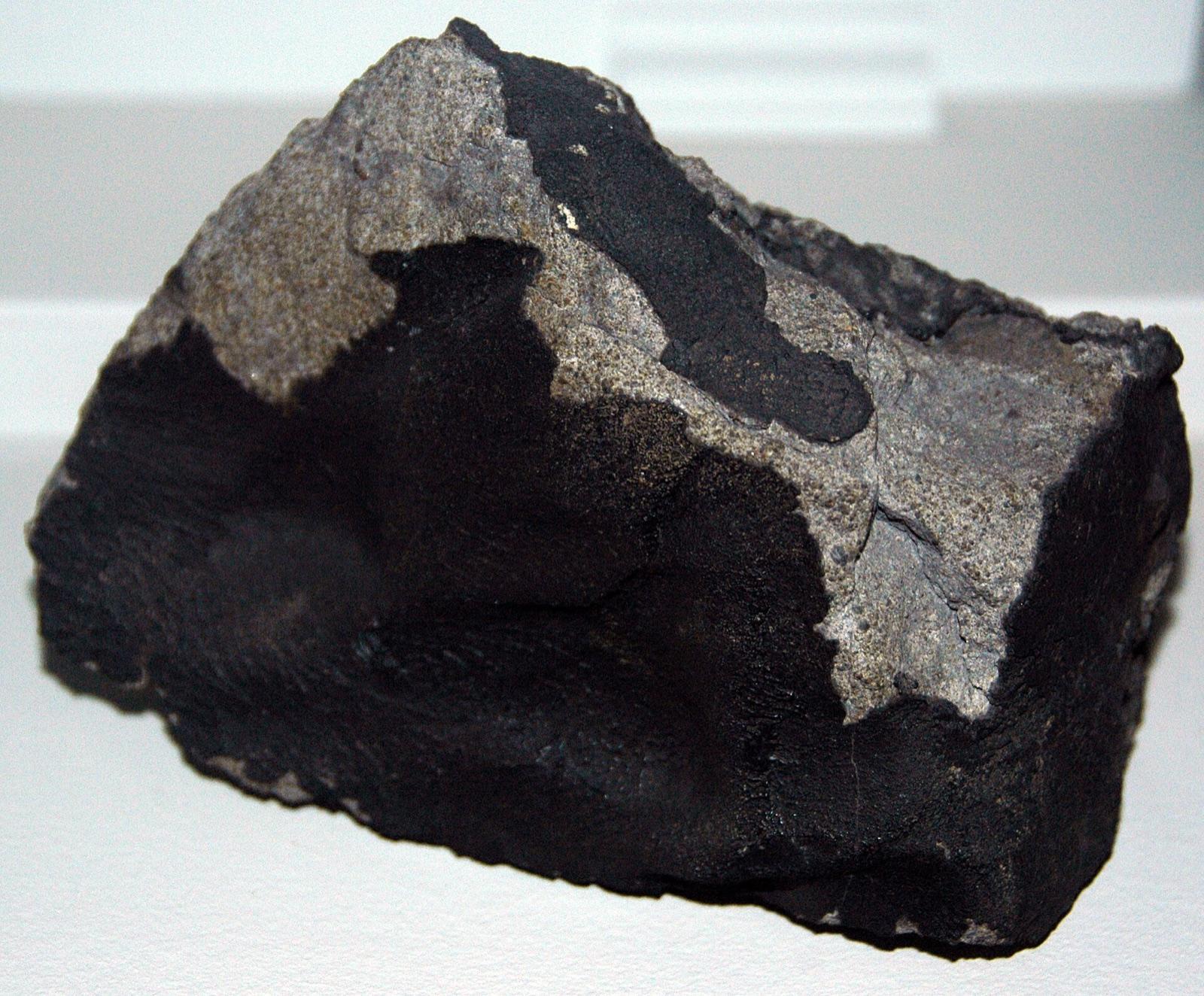 Ordinary chondrite with the dark fusion crust left by atmospheric heating