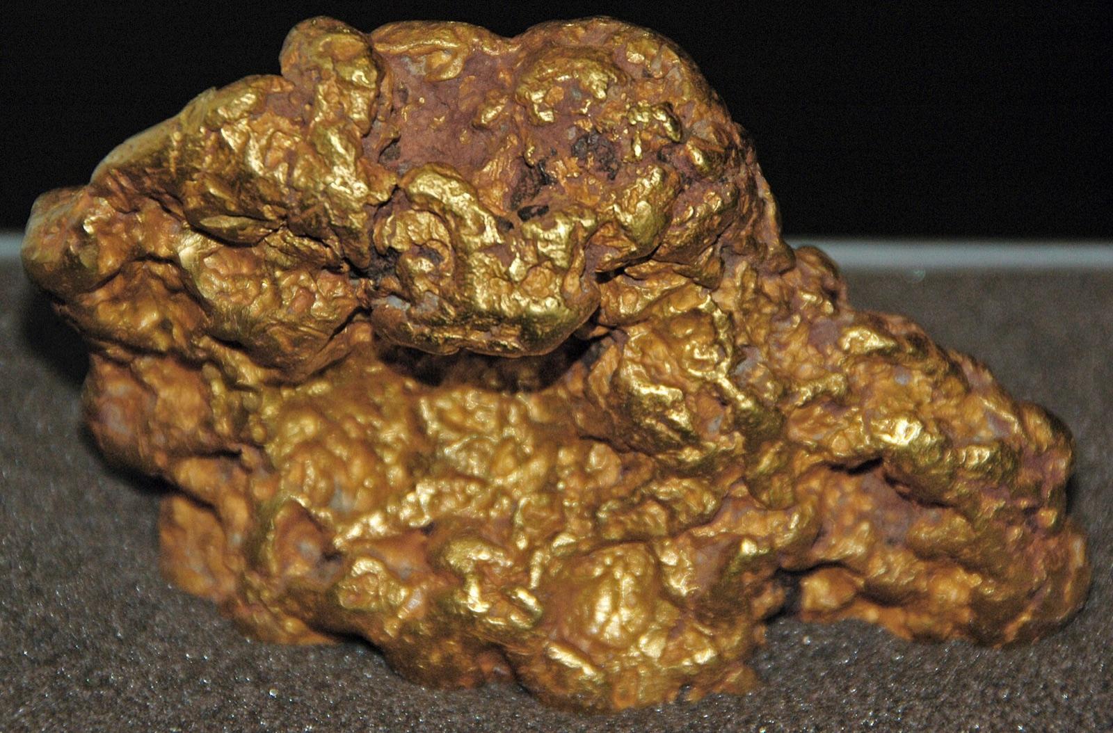 Natural placer gold nugget, water-worn and buttery yellow