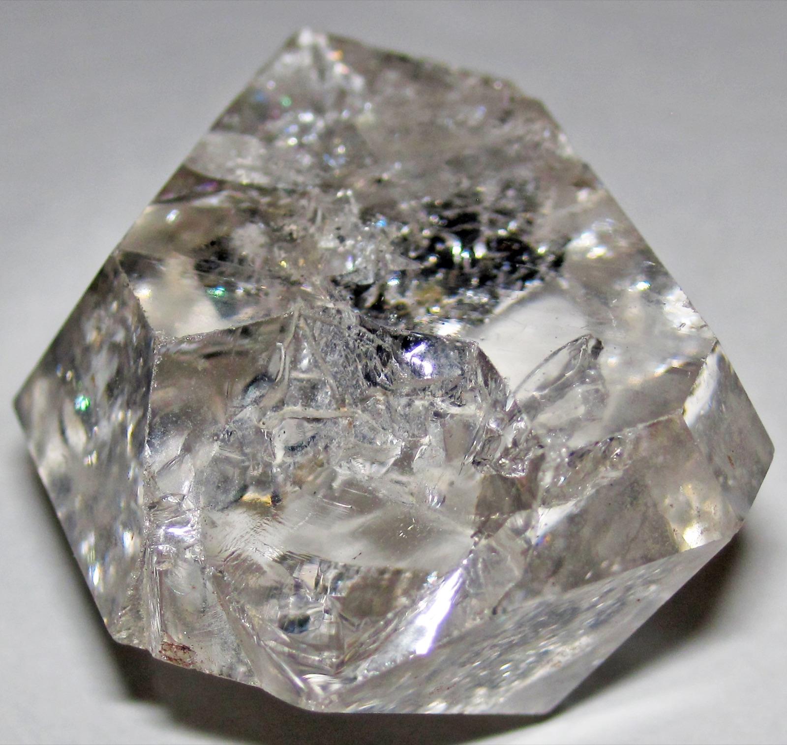 Herkimer diamond showing internal inclusions and glassy natural faces