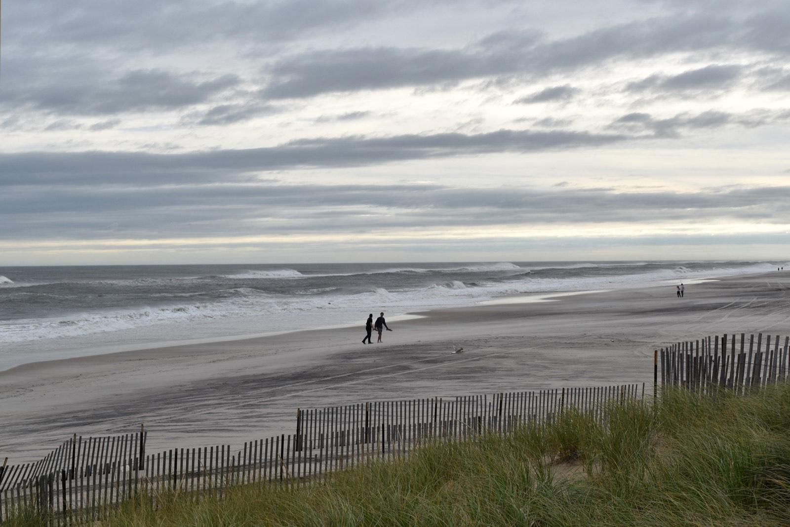 Storm surf and dune fence at Smith Point Beach on Long Island's south shore, Suffolk County, New York