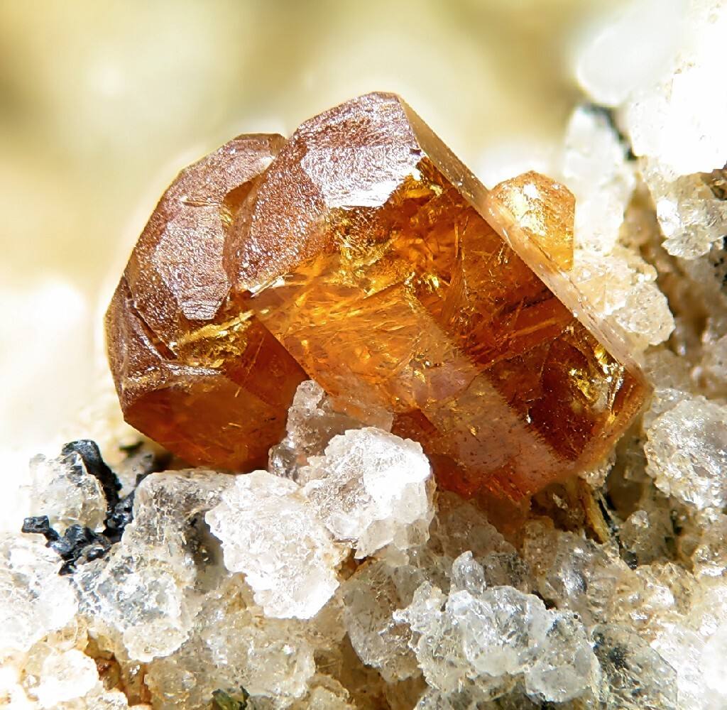 Honey-orange bastnäsite crystal group on quartz