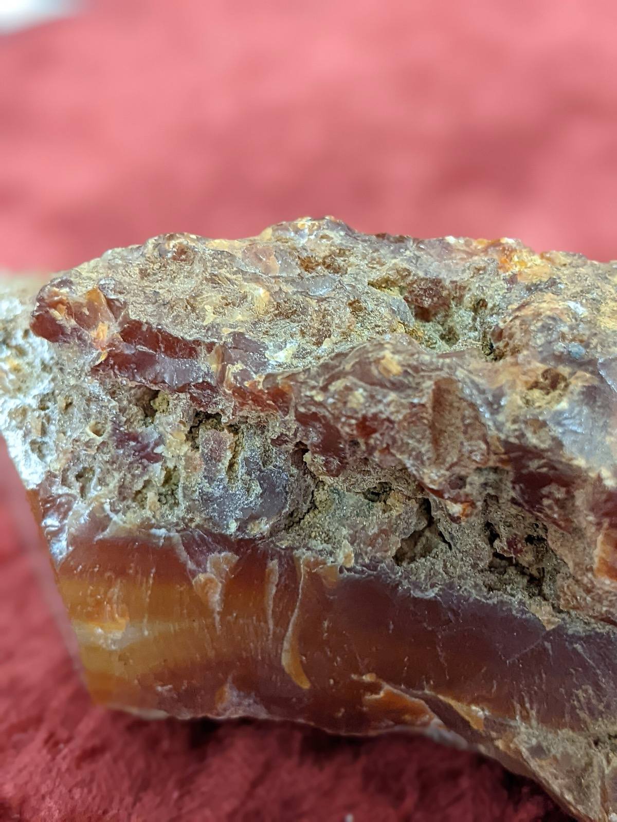 Carnelian nodule broken open, weathered rind over translucent interior, Oregon