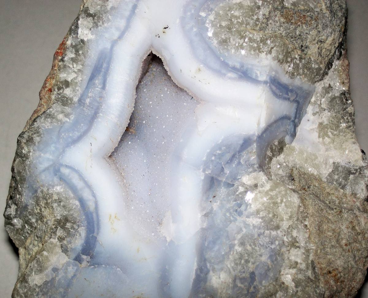 White and grey agate banding around a drusy cavity