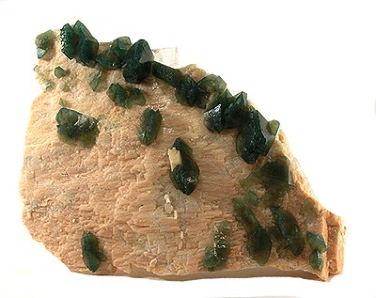 Dark green fluorapatite crystals on matrix