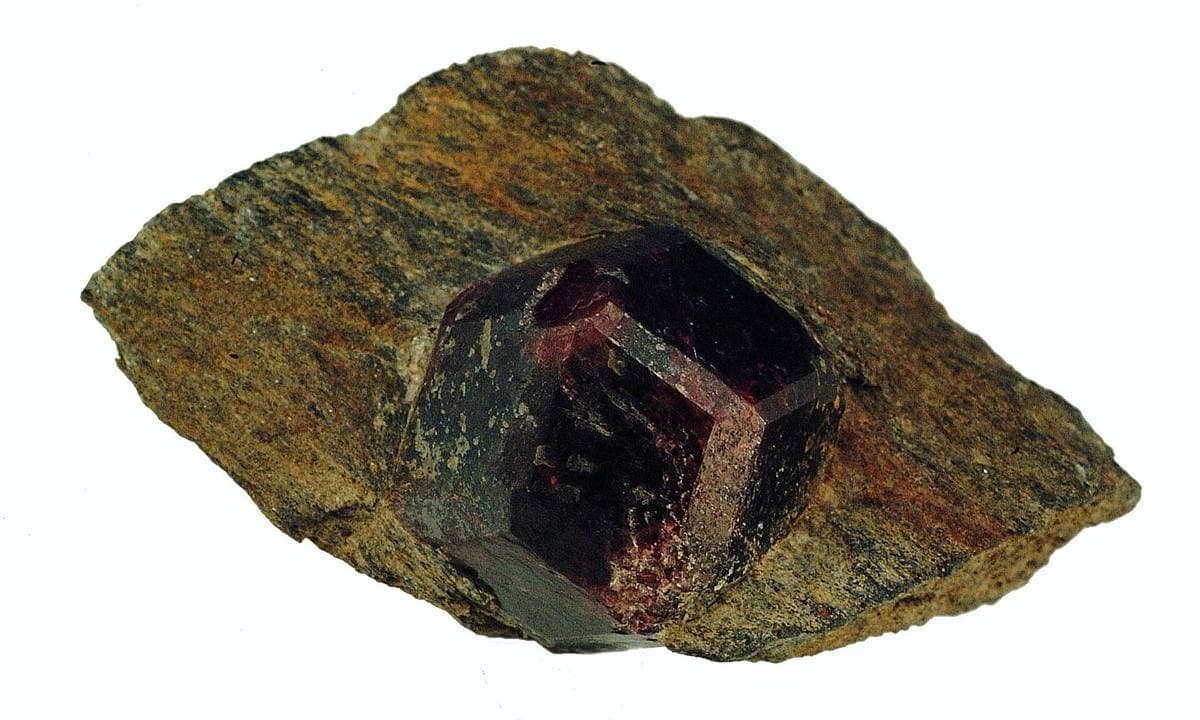 Almandine garnet dodecahedron in host schist