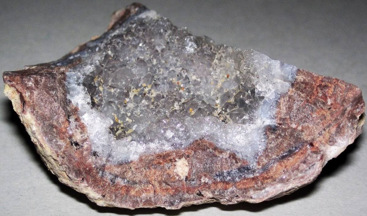 Cut quartz geode showing druzy lining and outer rind