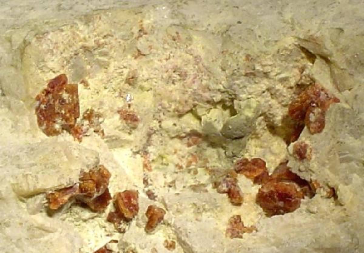 Orange-brown labuntsovite crystals in cavities, Khibiny Massif