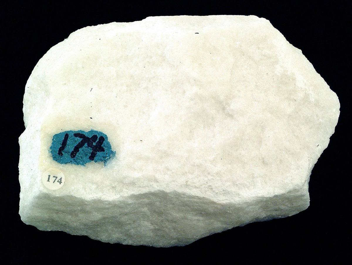 White marble hand sample showing sugary crystalline texture