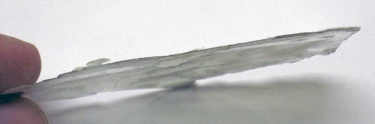 Thin muscovite cleavage sheet showing transparency and elasticity