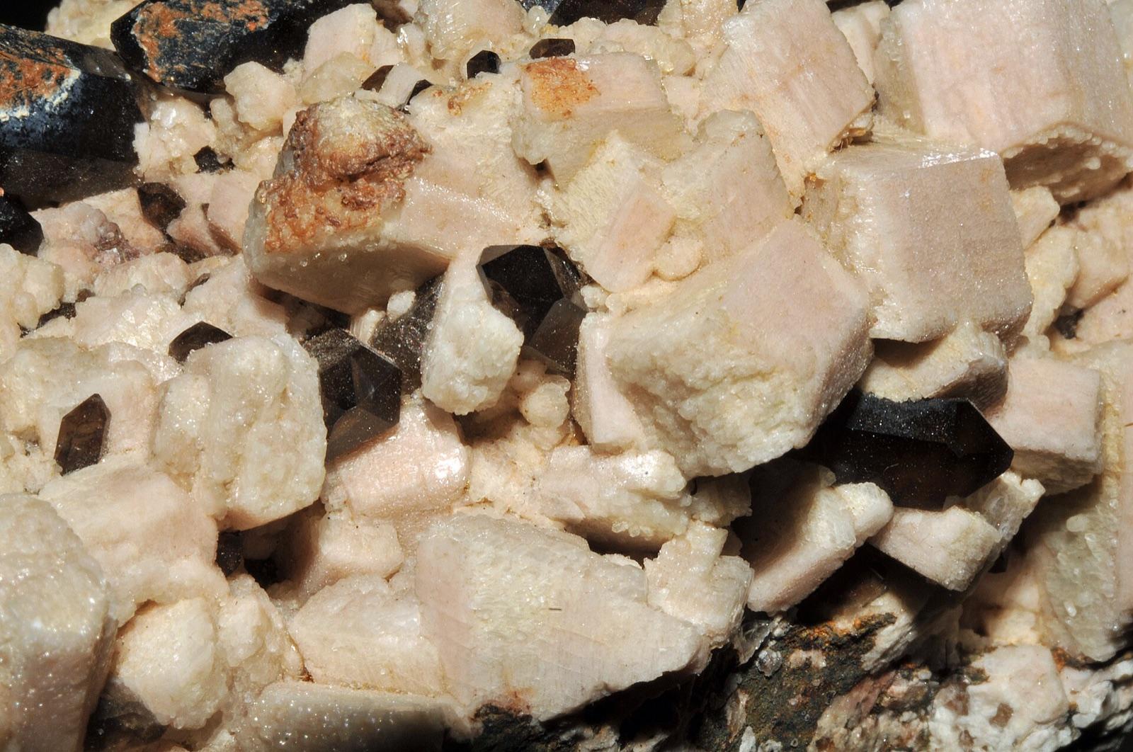 Pink microcline feldspar crystals with smoky quartz from Catamarca, Argentina