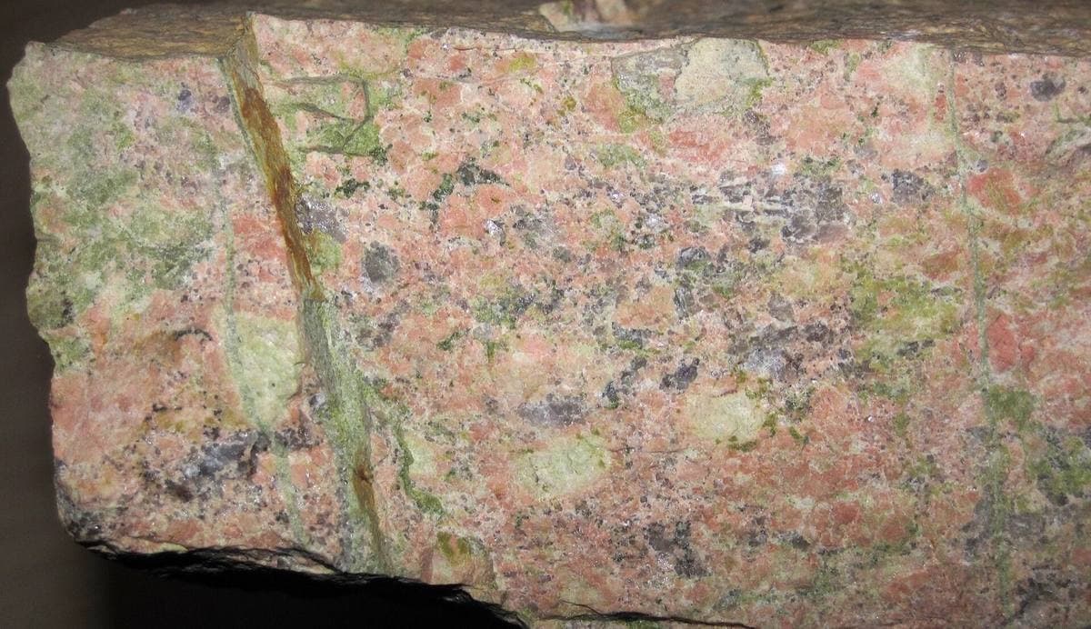 Rough unakite hand specimen with epidote veining, Buena Vista, Virginia