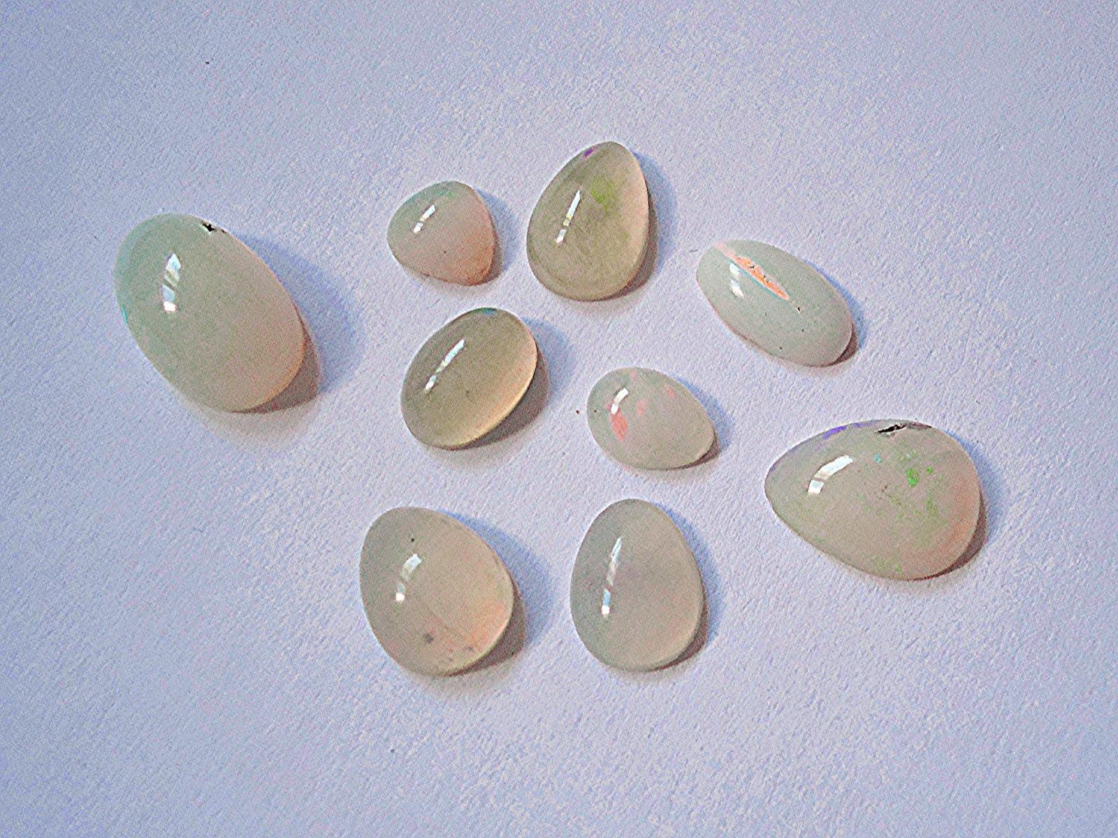White opal cabochons from Brazil with flashes of play of color