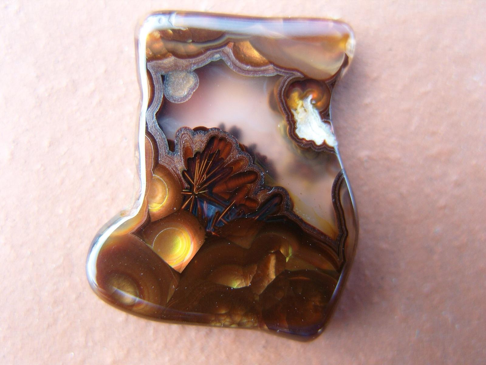 Polished sagenitic fire agate showing iridescent fire at Unnamed Location (Fire Agate), Riverside County, California