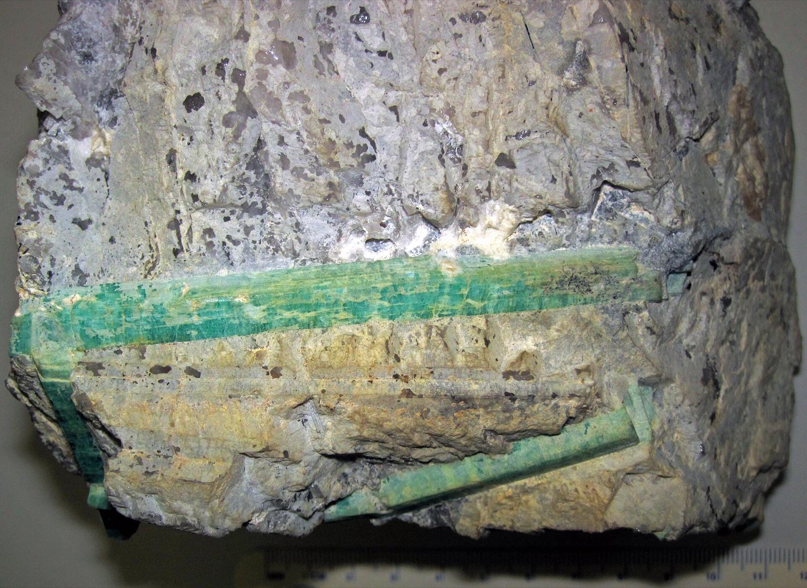 Green beryl crystals in pegmatite, like the beryl and aquamarine at Crystal Mountain