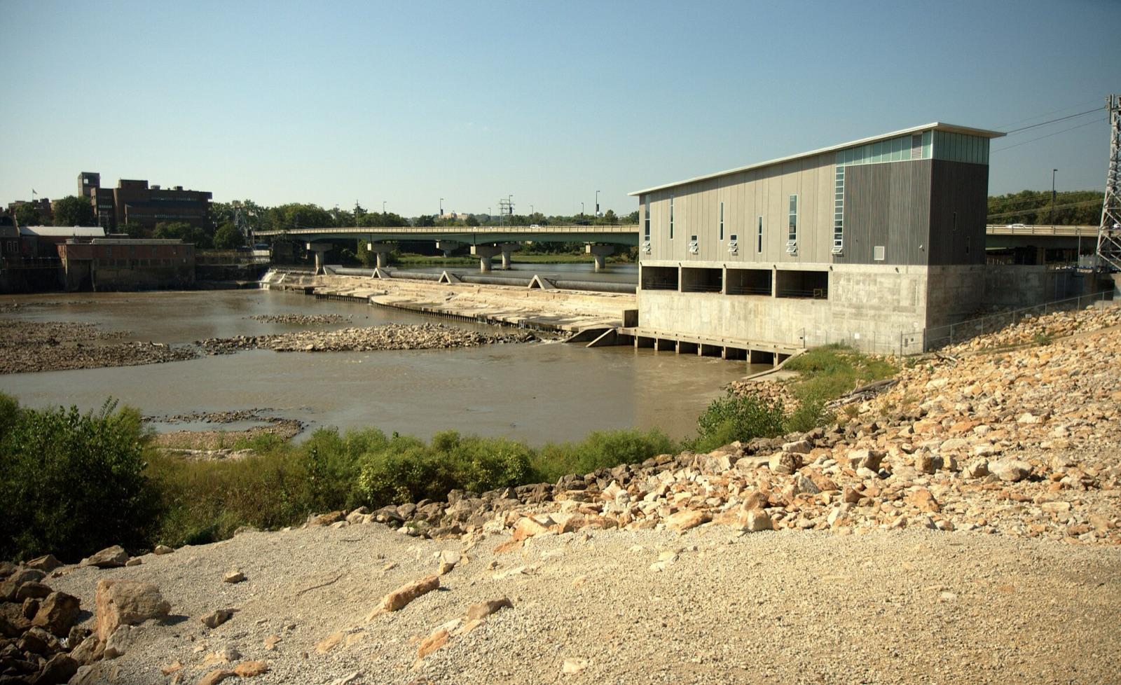 The Kansas River at Bowersock Dam with a rocky bank in Lawrence, Douglas County, Kansas