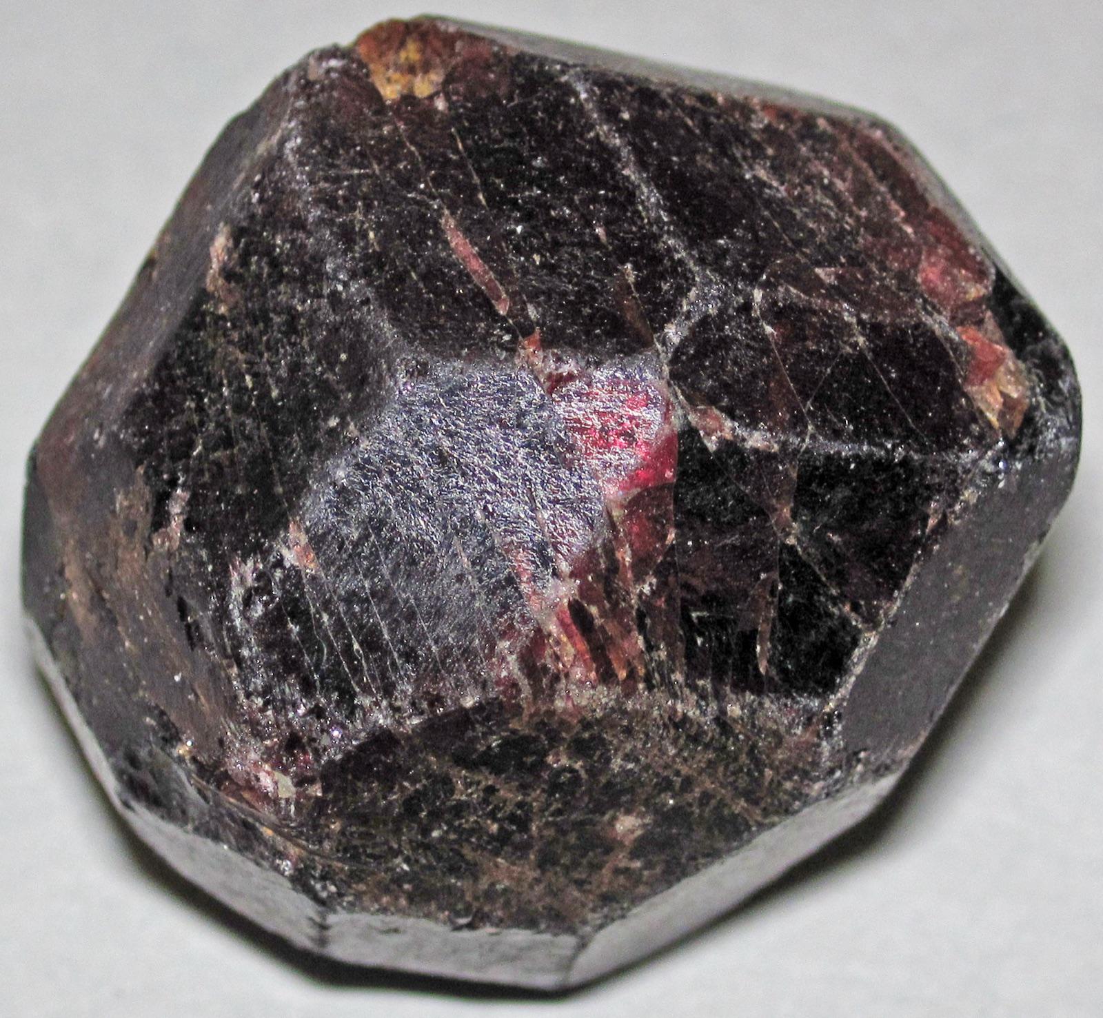 Deep red almandine garnet crystal showing dodecahedral form, a representative specimen of the garnet found at Ruby River, Madison County, Montana