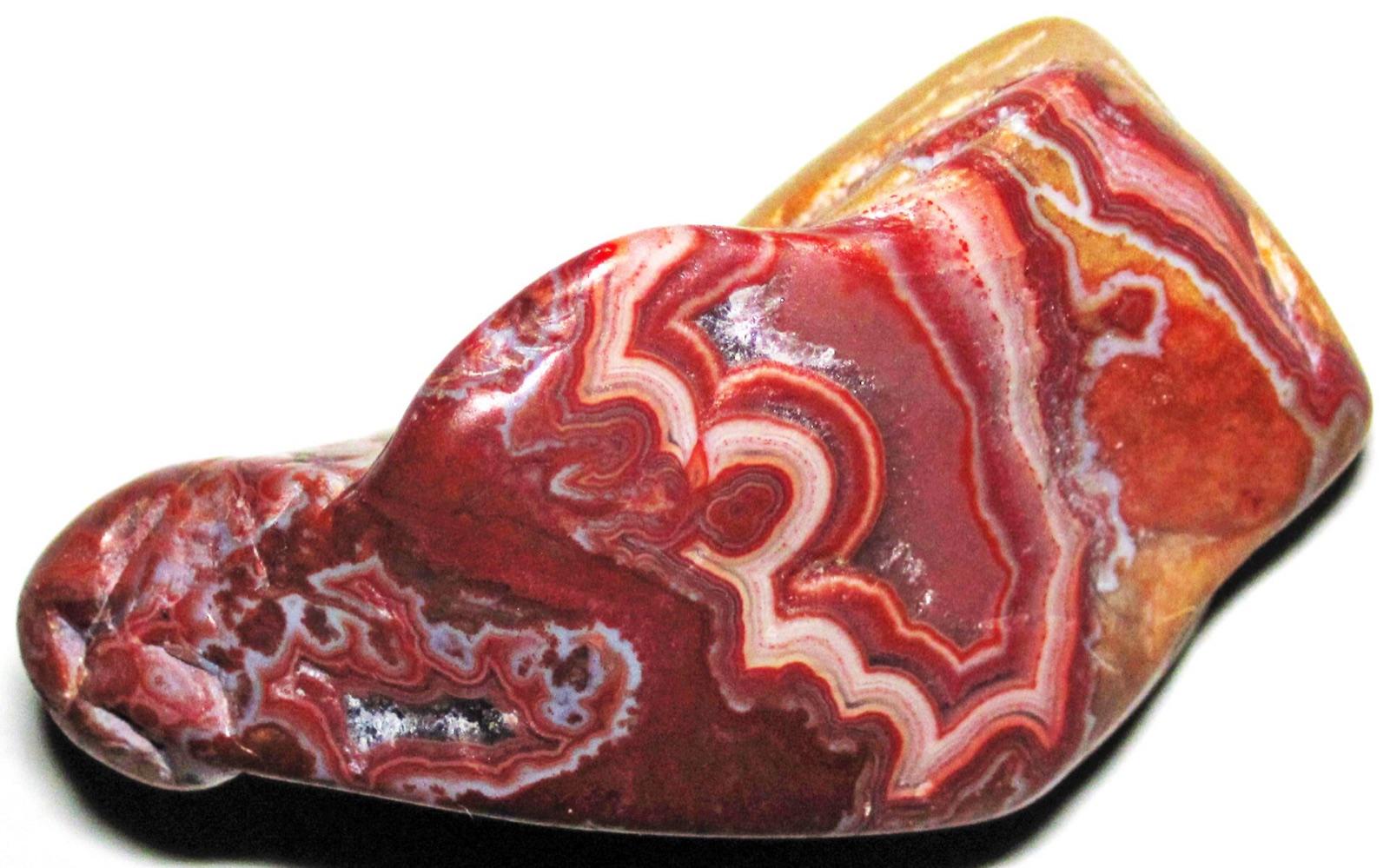 A polished Fairburn agate showing concentric red and white fortification banding, the prized fortification agate of southwestern South Dakota