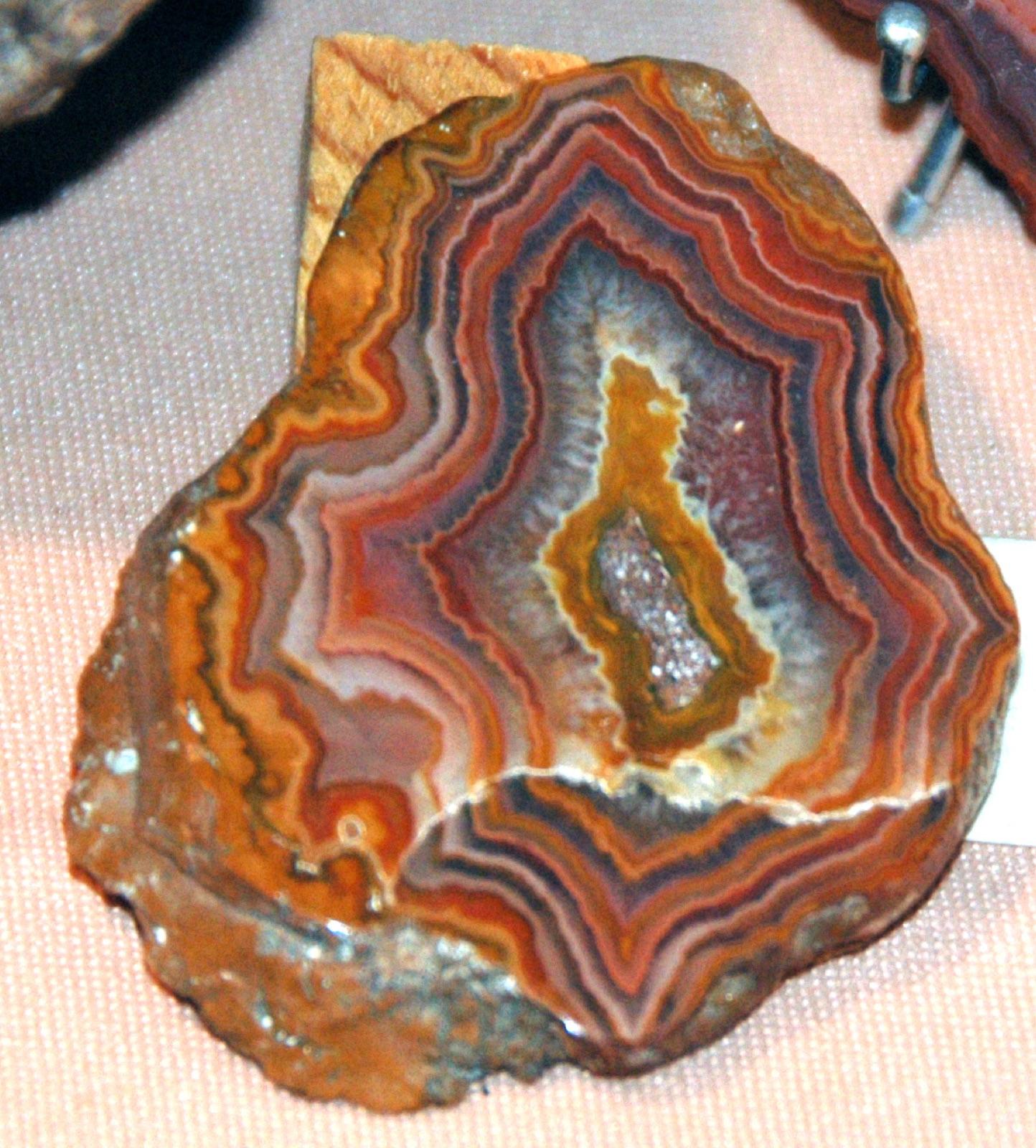 A Fairburn agate with tight fortification banding in red, orange, and white, the state gem collected in the badlands east of Fairburn