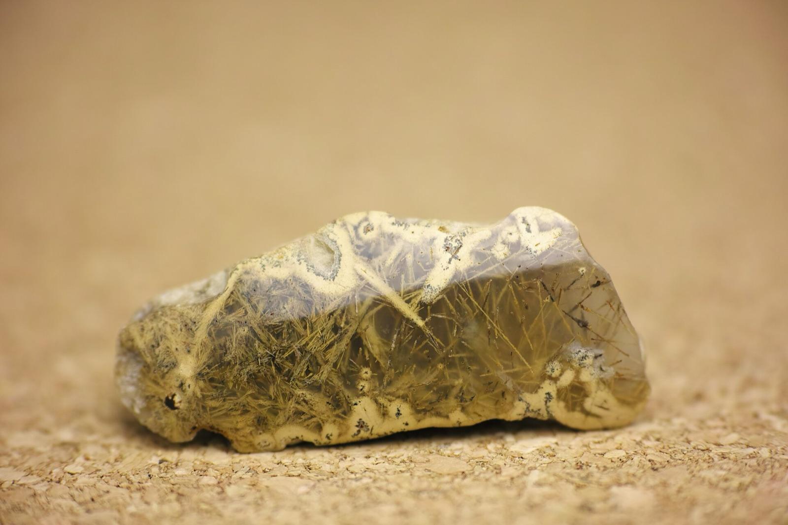 Translucent beach agate with sagenite inclusions, like the agate that washes up along the Pacific coast